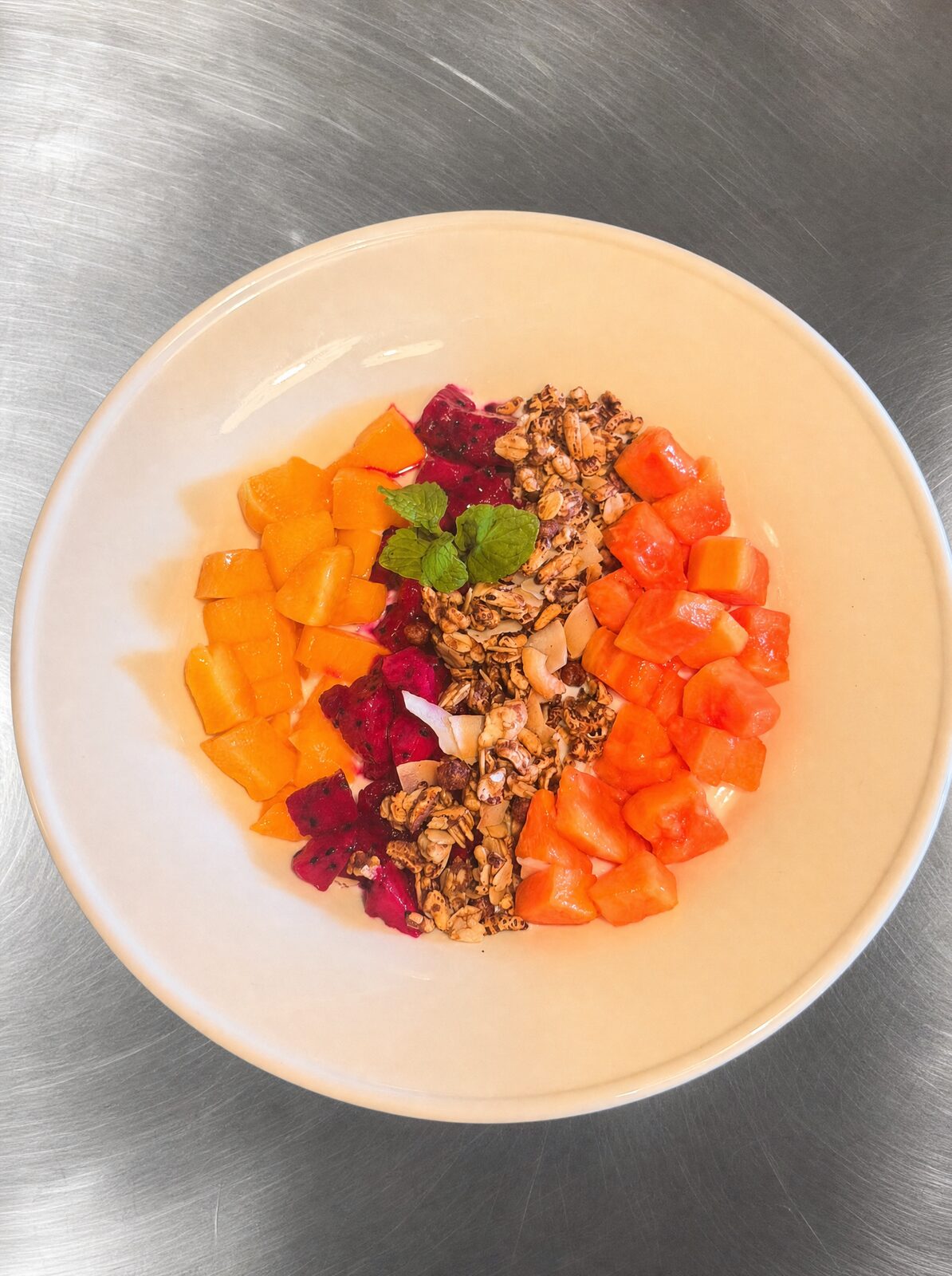 Thuy's famous yoghurt bowl with granola and seasonal fruit — Uluwatu breakfast